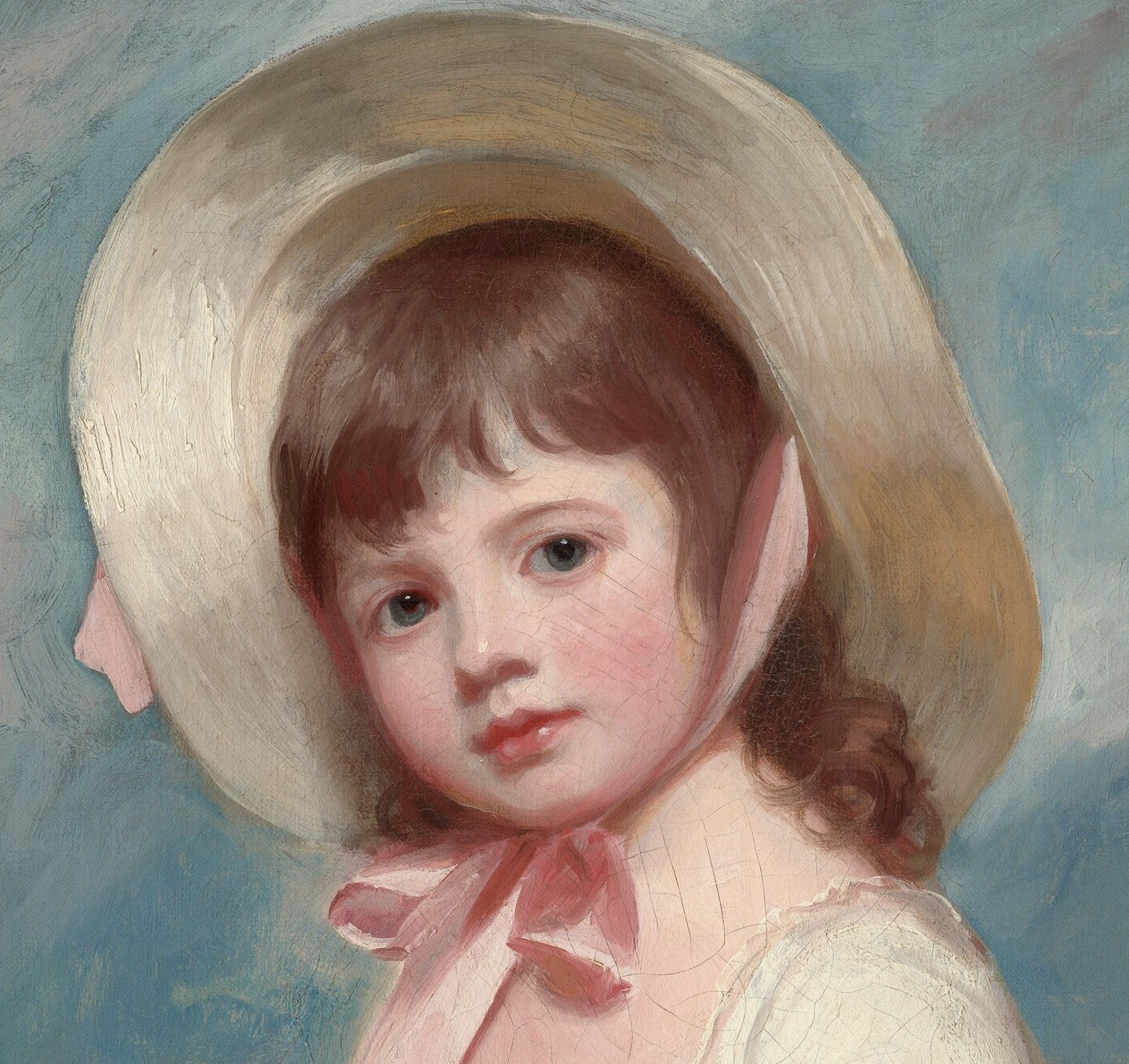 The hat frames her face and casts a slight shadow, adding depth and highlighting her delicate features.