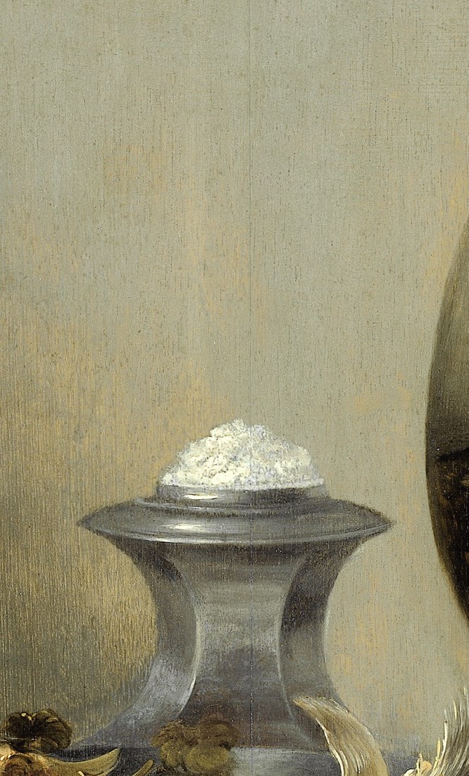 The salt cellar is solid silver, built from cool white highlights.
