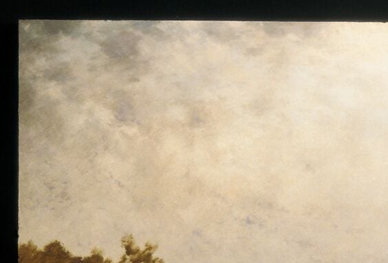 Notice how the clouds dissolve into the vast, pale sky.