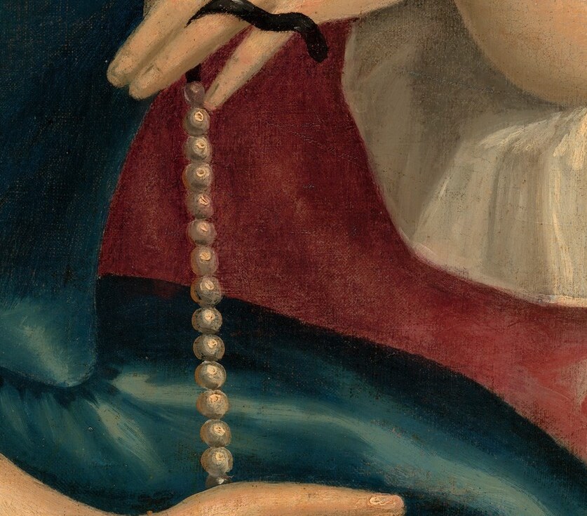 The careful rendering of her fingers and the way they interact with the pearls suggests a gentle touch.