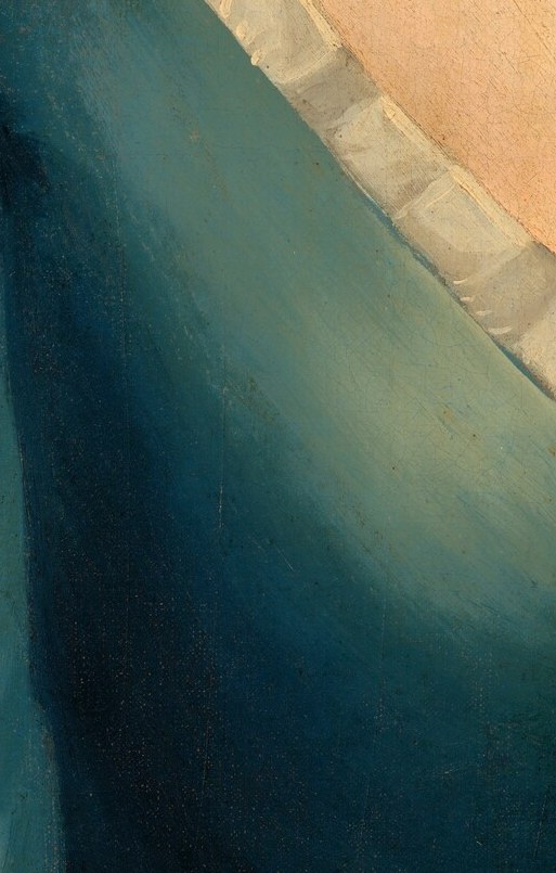 The crisp white fabric provides a striking contrast to the deep blue of her dress.