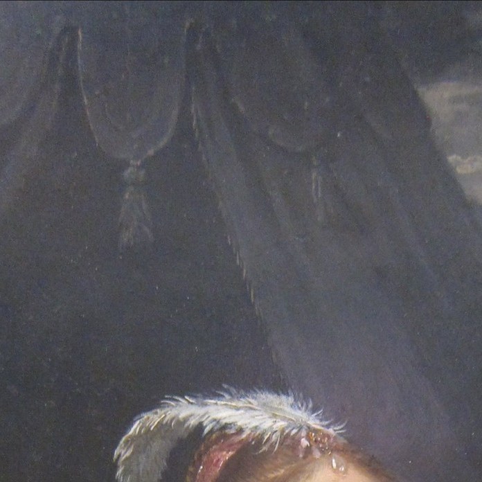 Serene, almost detached expression belies the violence just committed , the emotional core of the painting and its central interpretive puzzle.