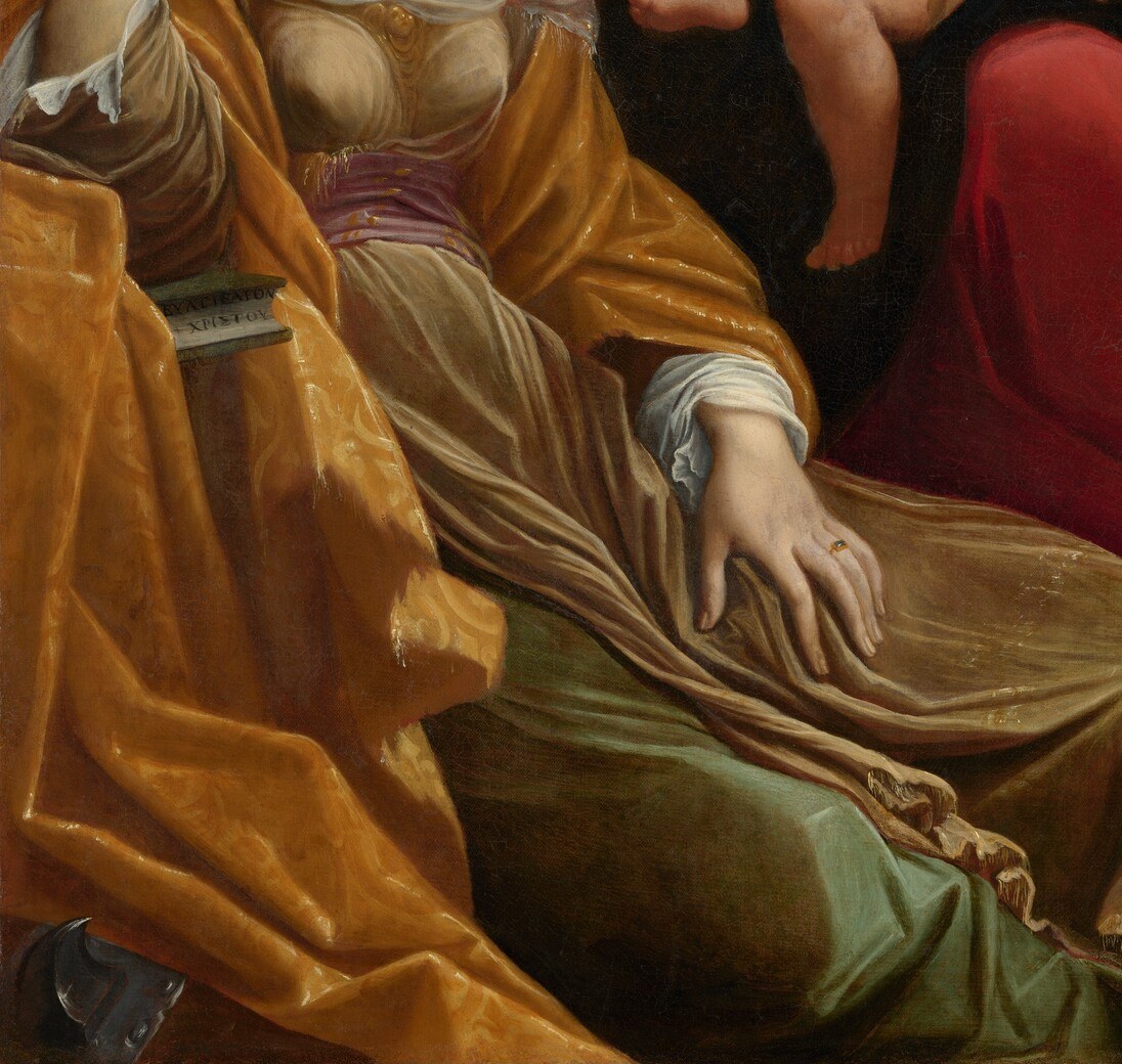The broad ochre fabric is Carracci's technique showpiece: deep folds modeled in chiaroscuro give physical weight and earthly warmth to an otherwise other-worldly scene.