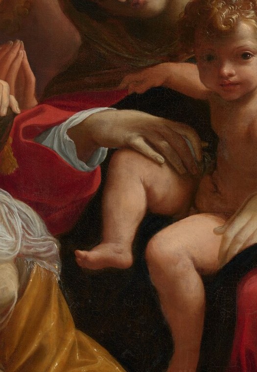 The infant Christ is the dream's object and its light source; his soft flesh modeling against deep shadow demonstrates Carracci's chiaroscuro at its most deliberate.