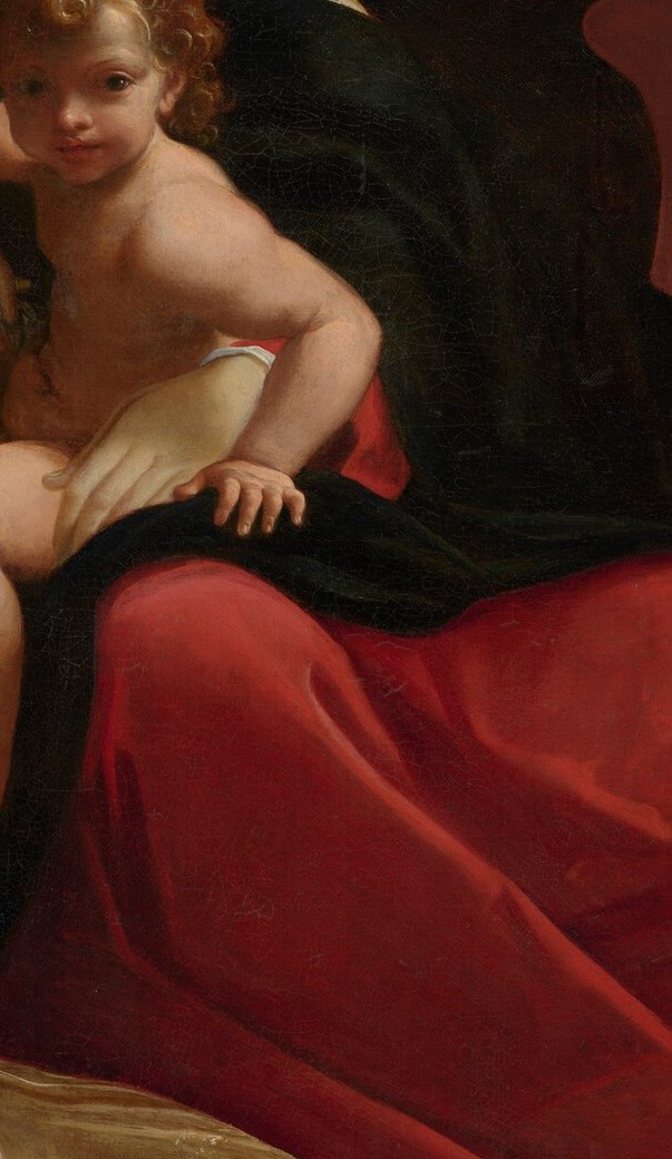 Saturated red against near-black wings produces the painting's sharpest coloristic shock; the red may carry martyrdom symbolism linking angel and saint through shared sacrificial iconography.
