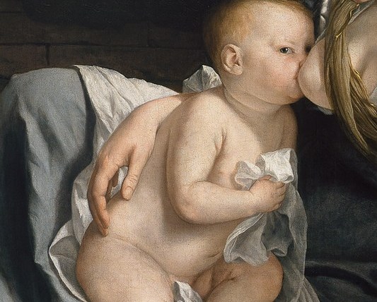The child looks directly at us, aware of his destiny.