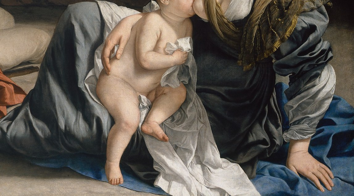 Mary nurses the child. Her robe is deep blue.