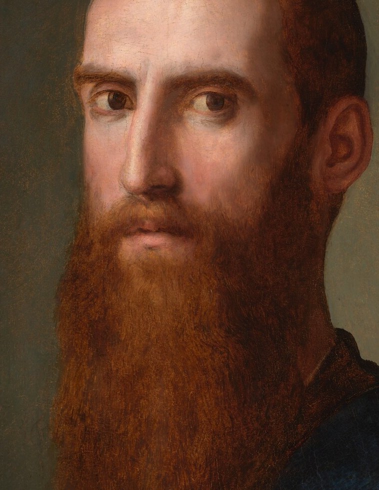 His direct gaze is intense and unsettling, suggesting a complex inner life or a challenge to the viewer.
