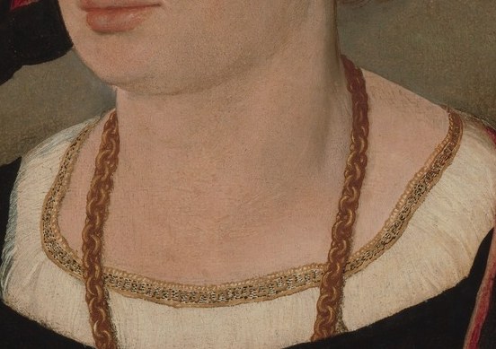 He was a wealthy man, evident from his gold necklace.