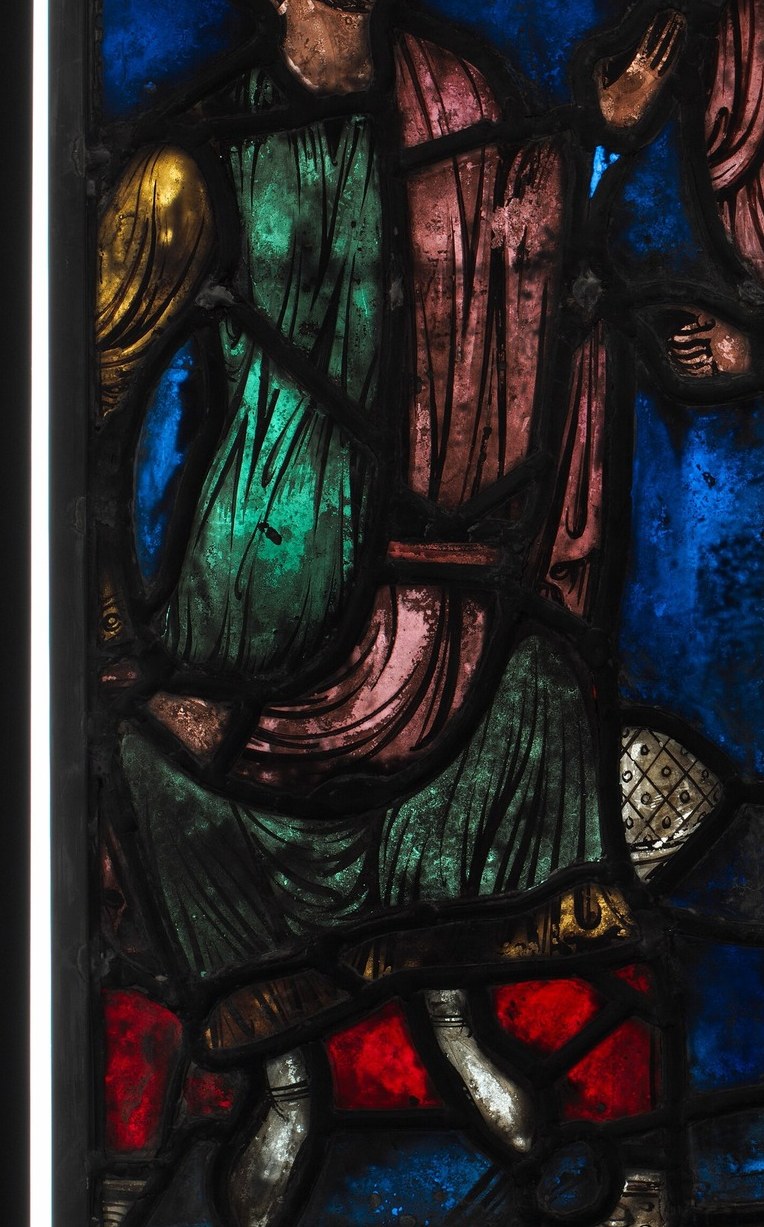 And this man, clad in green, kneels in desperate prayer.