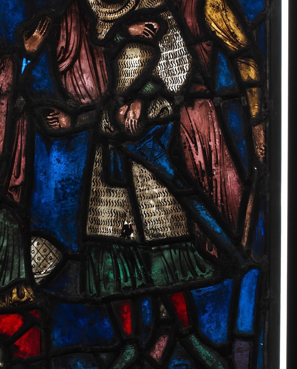 A soldier in blue armor points downward, passing judgment.