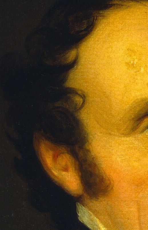 Even his neatly trimmed sideburns signal the exact decade.