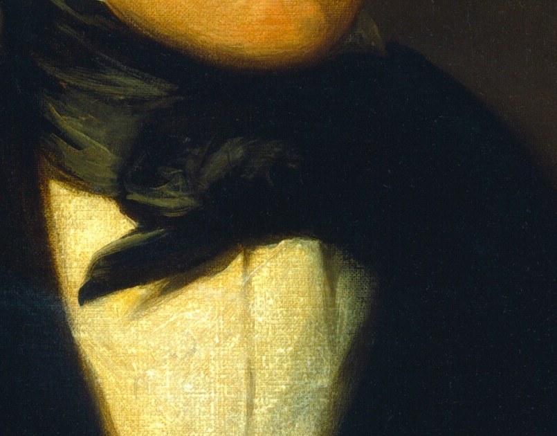 His high white collar and stock cravat, a strong tonal contrast.