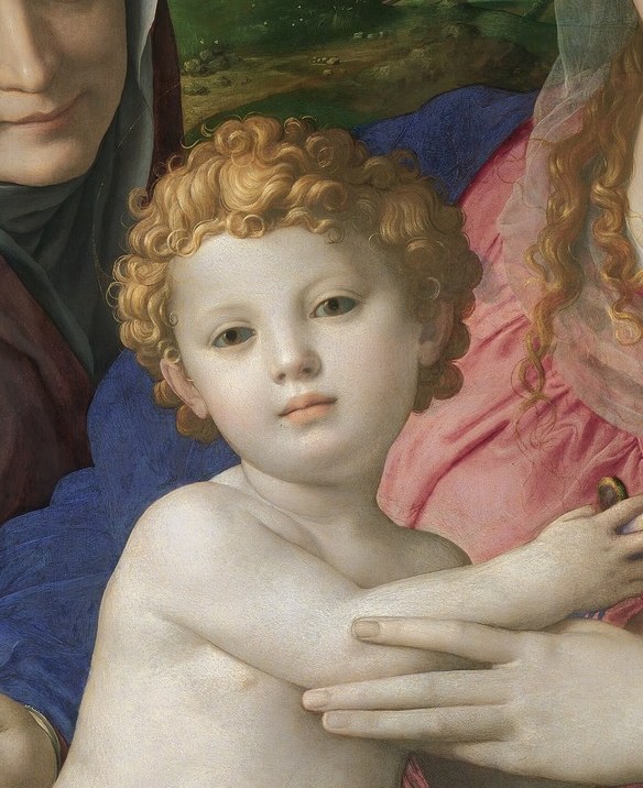 His plump, lifelike form and direct gaze convey innocence and divine presence.
