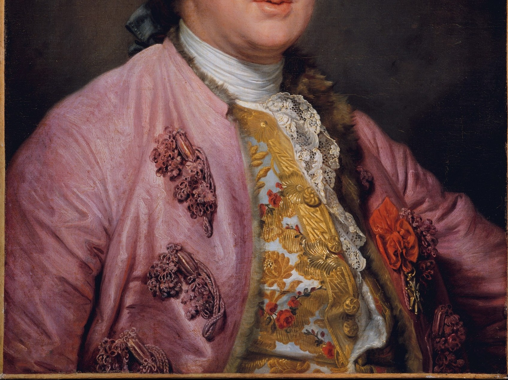 He wears the confident pink of the French Rococo.