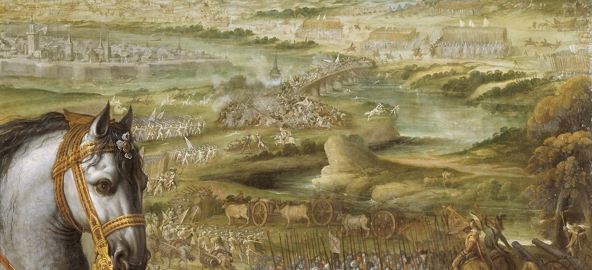 The battle rages in the background, a chaotic, distant conflict.