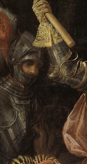 His commander's baton signifies his authority and leadership.