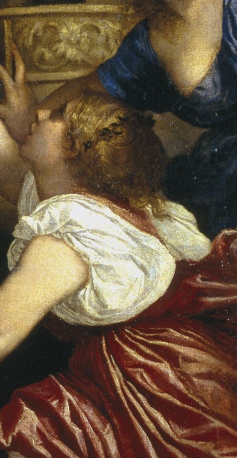 A woman in blue watches intensely, deeply involved.
