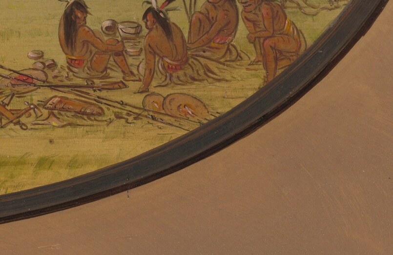 Disarmed for play, spears and shields rest on the ground.