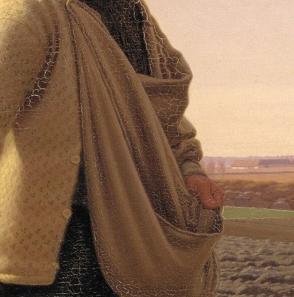 His worn bag holds life for the soil.