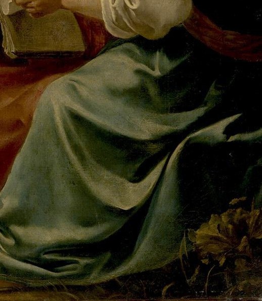 Her posture and expression convey a sense of quiet contemplation and appreciation of the music.