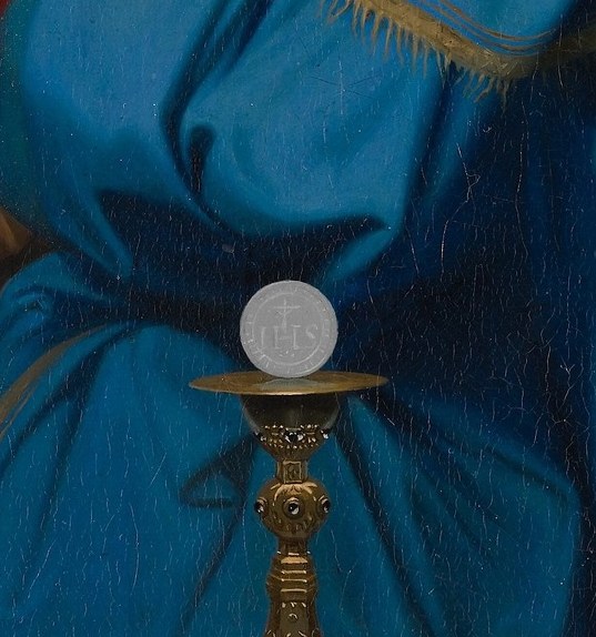 Richly detailed goldsmith work catches the warm ambient light; its verticality anchors the altar table and roots the sacred pyramid of Virgin-hands-host.