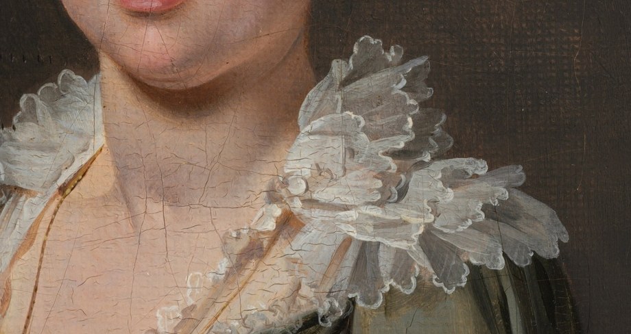 Her ruffled lace collar was a mark of status.