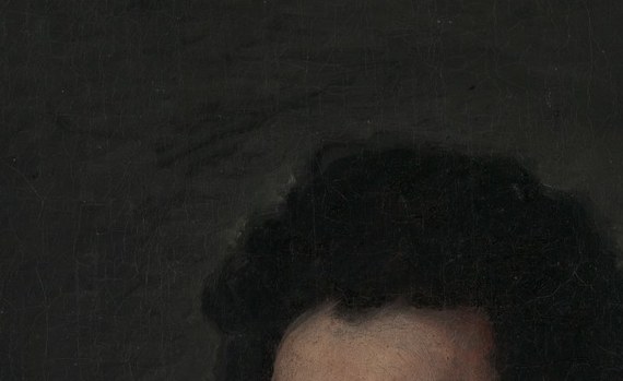 His dark, direct eyes search out of the murk. He is alert to the moment.