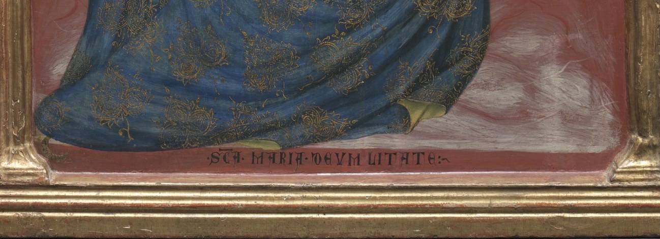 She wears it while seated on the ground, no throne, no palace.