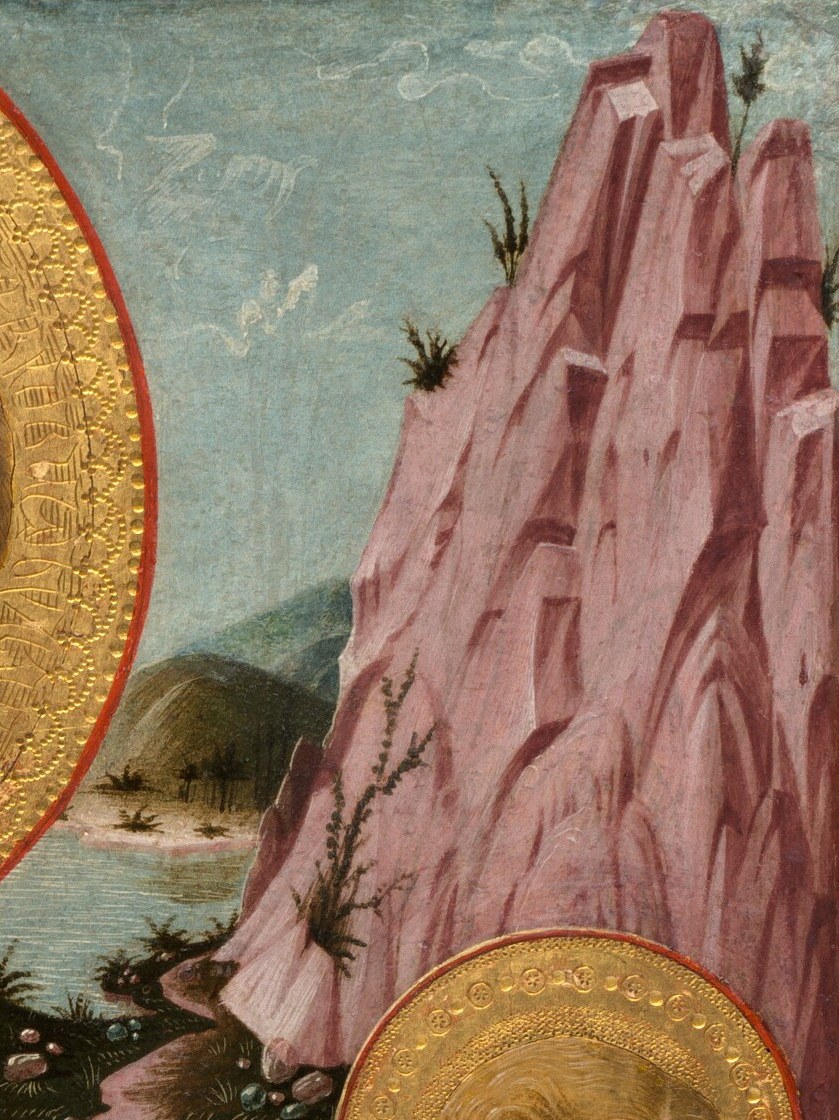 Go deeper. Look at the rock behind the angel's halo.