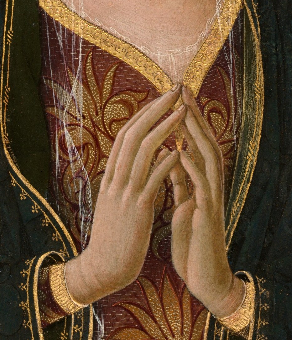 Look at her hands.