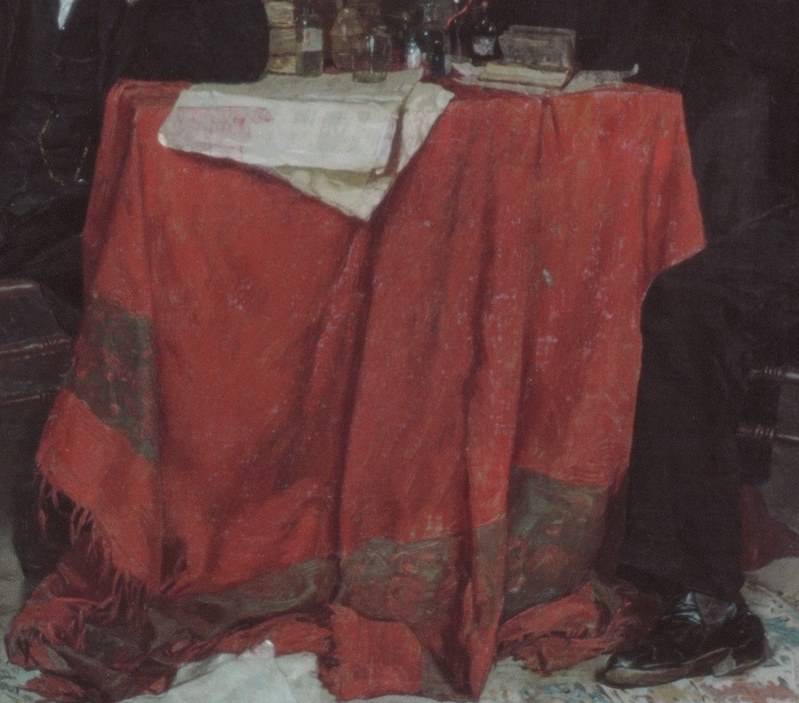 The rich red fabric adds a focal point and a sense of warmth or importance to the central discussion.
