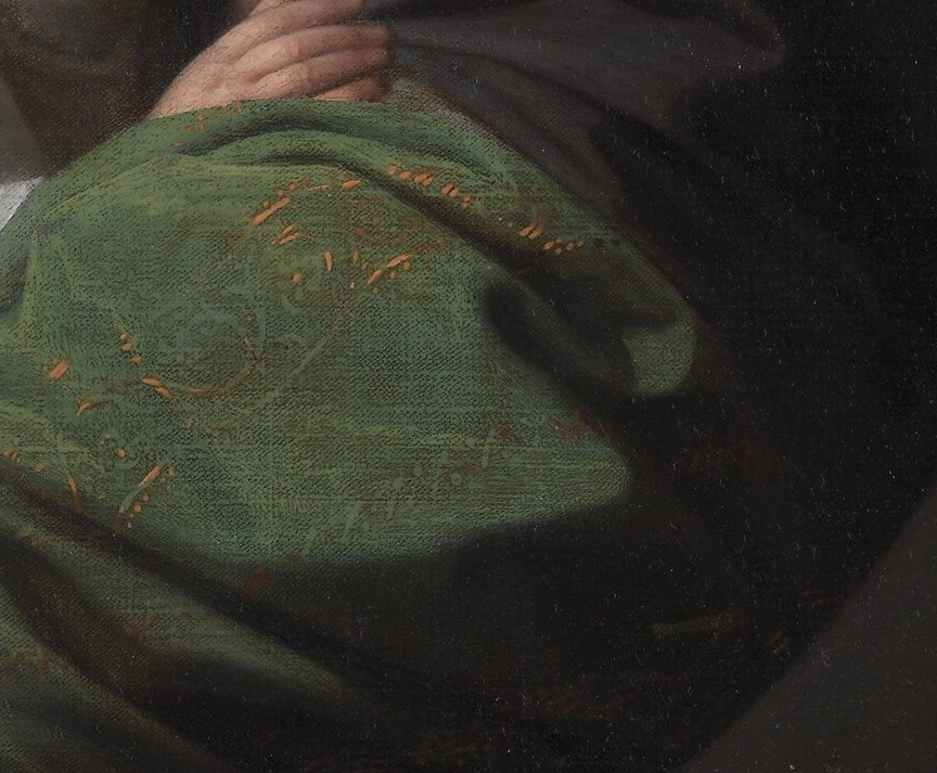 The rich texture and deep green color of the shawl add a sense of warmth and luxury to the composition.