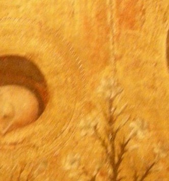 His downward gaze and bowed head convey humility and reverence before the divine message.