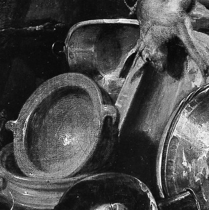 These reflective surfaces catch the light and add visual interest, suggesting domesticity or a meal.