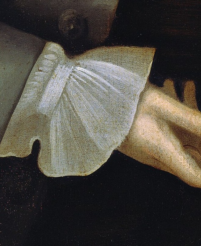 The finely detailed lace of the cuff showcases the artist's skill and the sitter's affluent status.