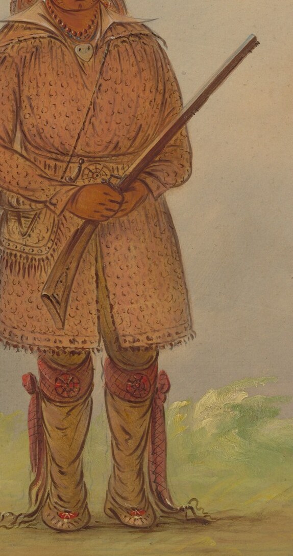 This man holds a long staff, a symbol of authority.