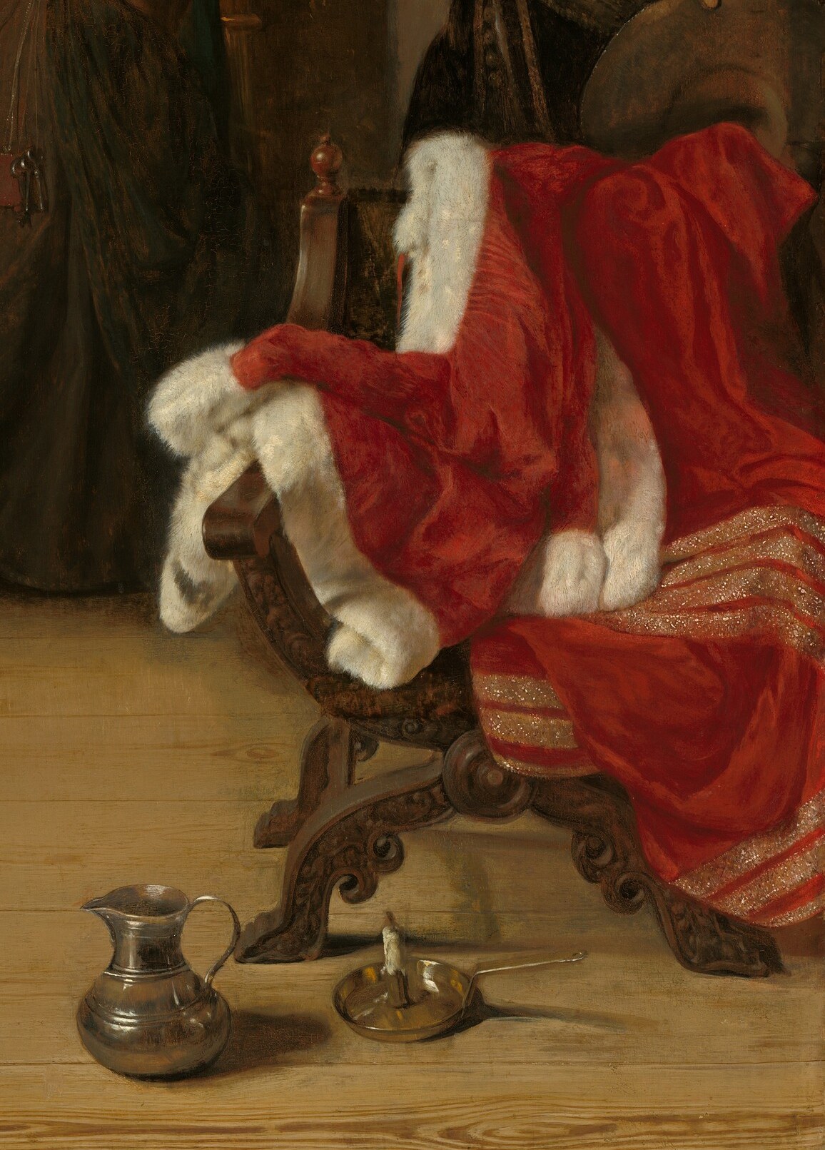 The red robe on the chair symbolizes wealth and luxury.