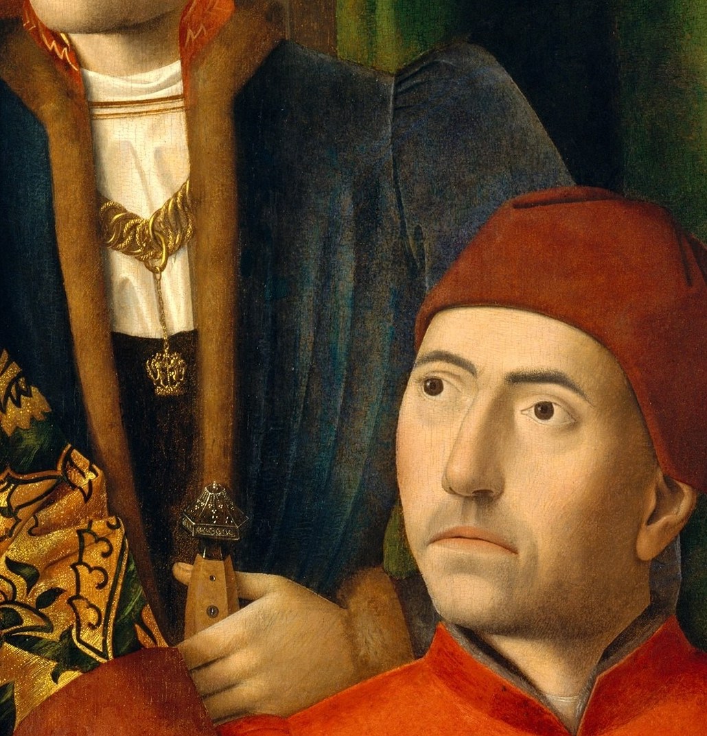 His concentration is total; the slight tilt of his head and steady gaze at the object in hand conveys the precision and authority of a master craftsman.