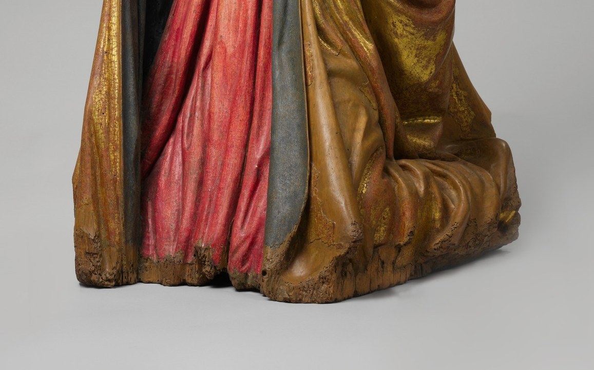 The act of kneeling signifies reverence, submission, and prayer.