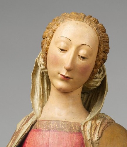 Her serene face suggests quiet contemplation.