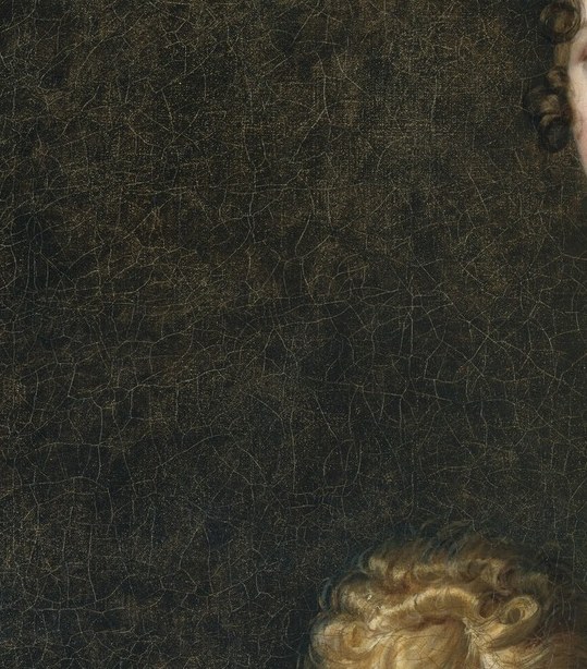 The child looks upward with soft, rounded features , a deliberate contrast to his mother's composed directness, creating the picture's only vulnerability.