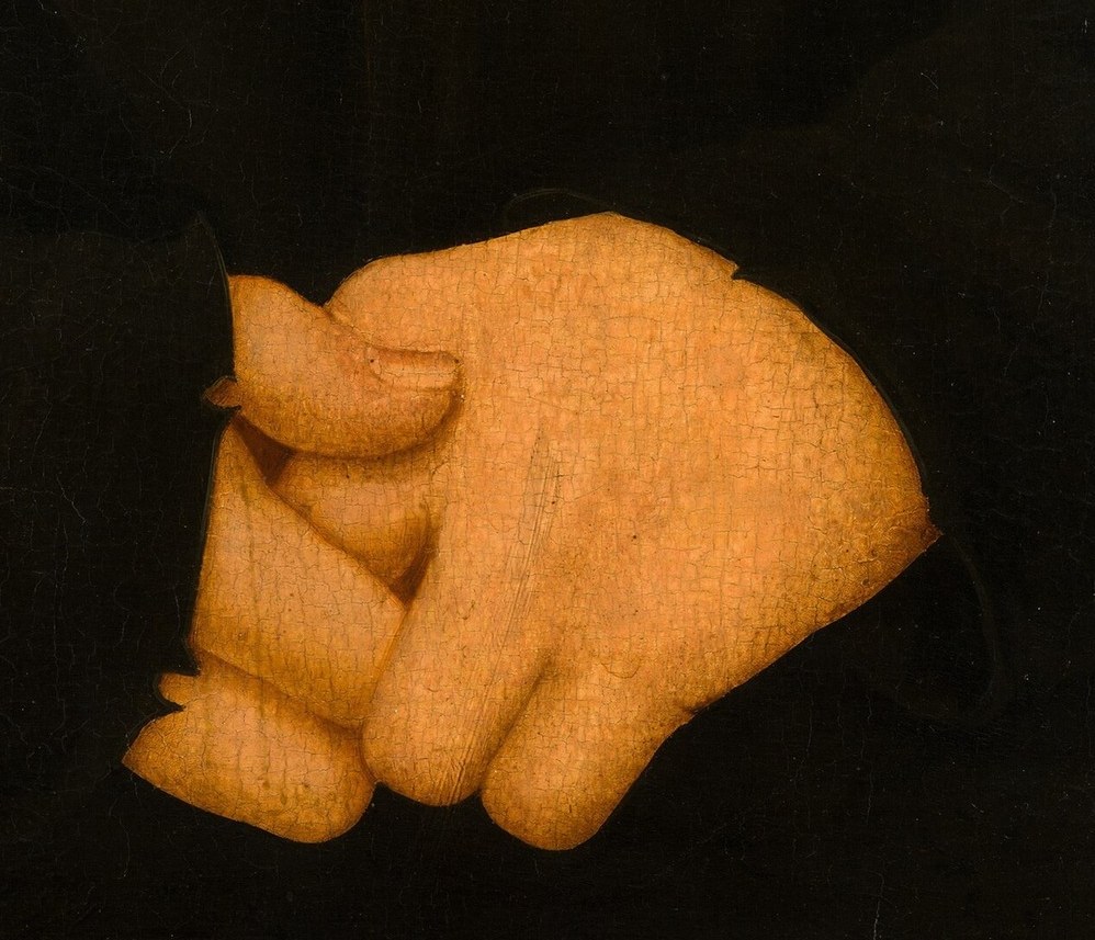 His folded hands suggest composure amidst a changing world.