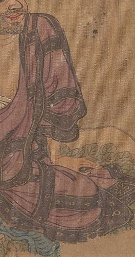 His patterned robe and scroll hint at knowledge and spiritual importance.