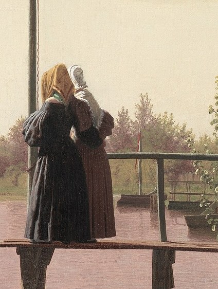 A woman stands on the pier, looking out.