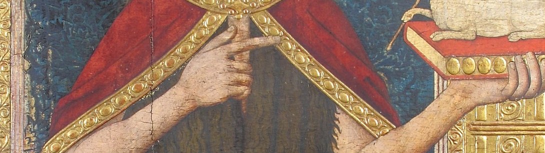 Look closely at the golden trim on his robe.