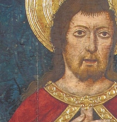 The radiating halo signifies his sainthood and divine connection, a common symbol in religious art.