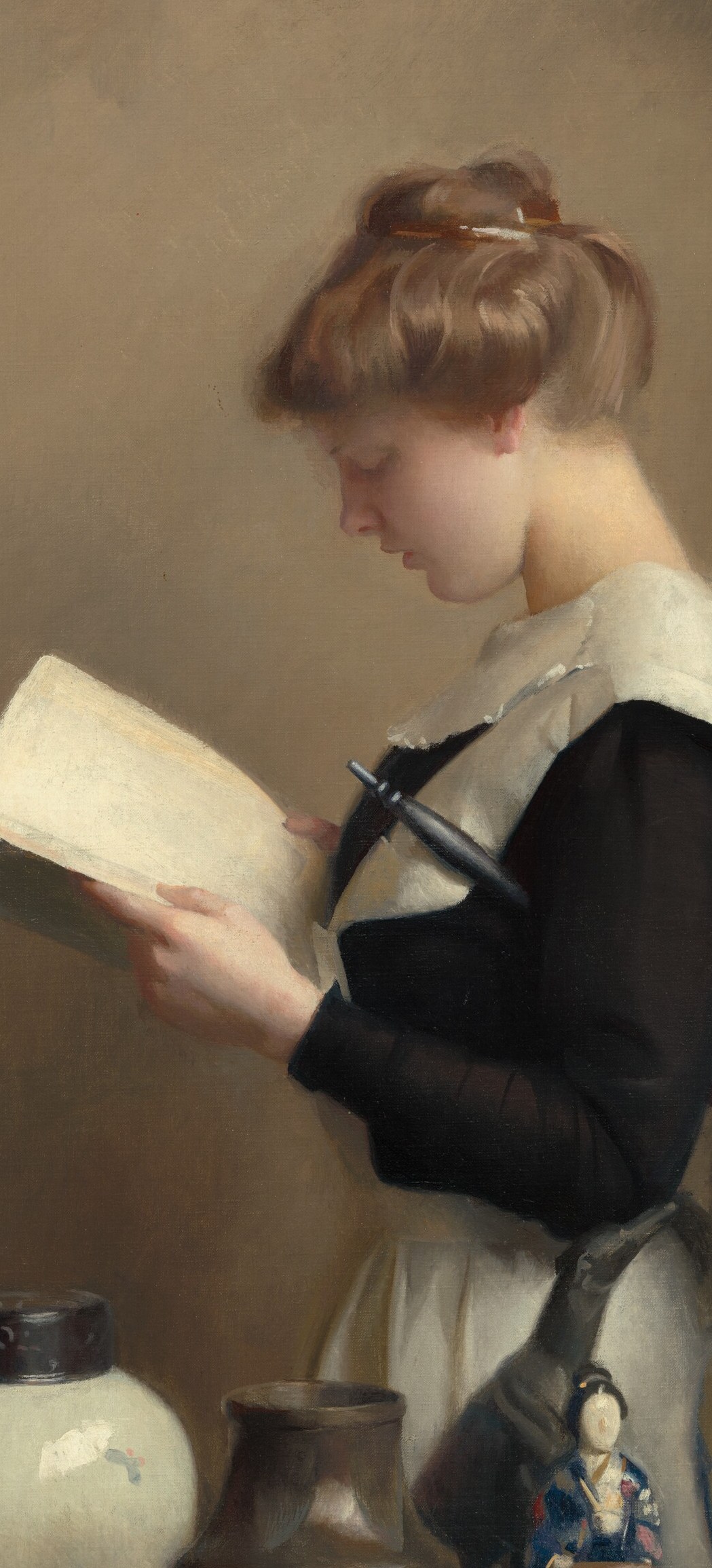 A housemaid reads, her back to us, illuminated by a window.