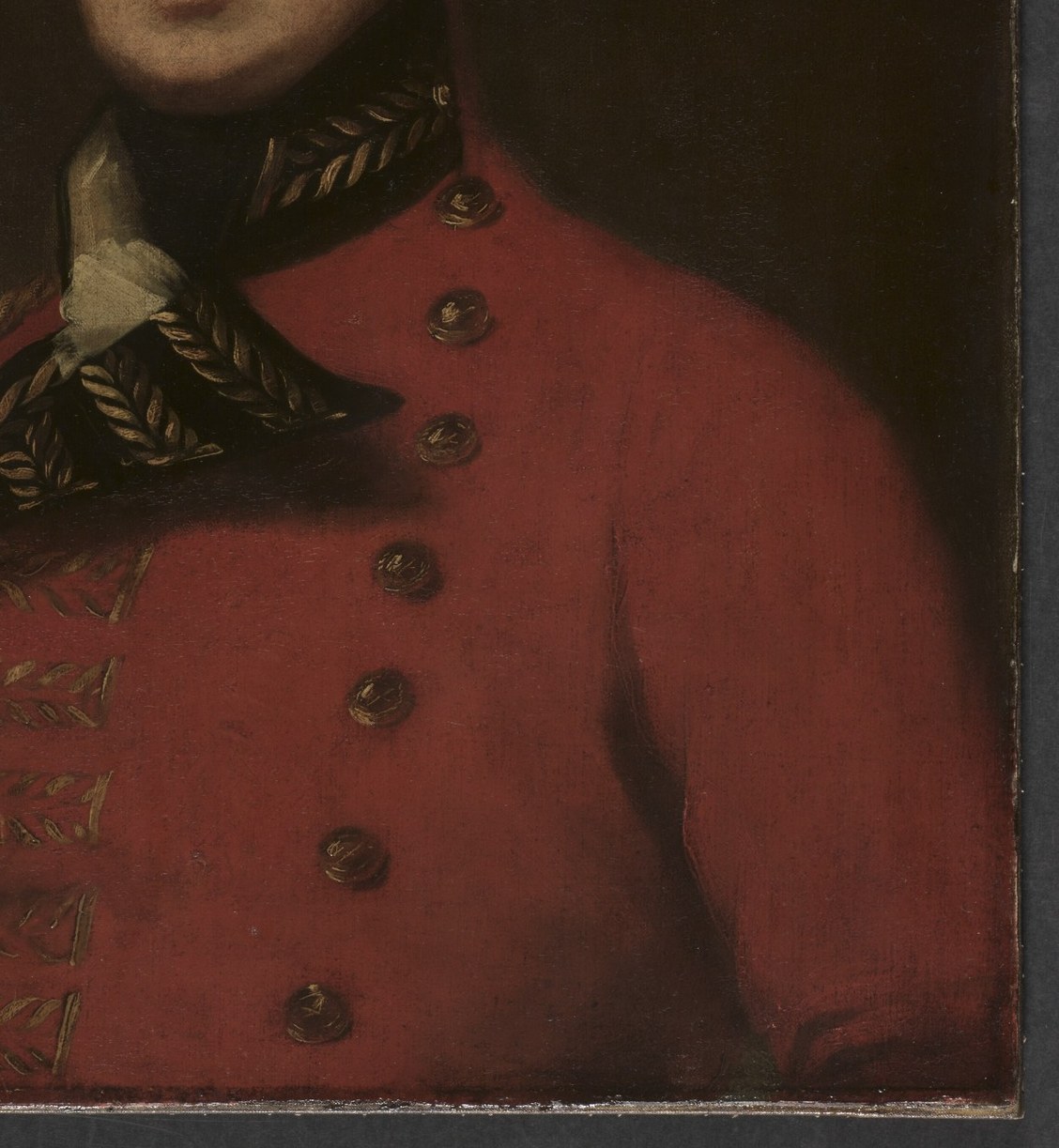 His vibrant red coat is a clear sign of military authority.