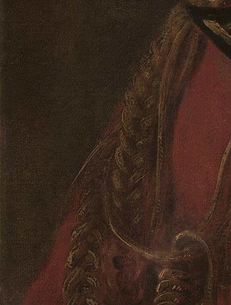 The detailed shoulder epaulet also marks his distinguished service.